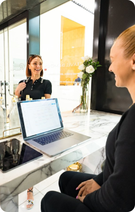 Woman checking in for an RPA treatment at Casa Privee. Book your appointment today at the top clinic for concierge medicine Miami offers.