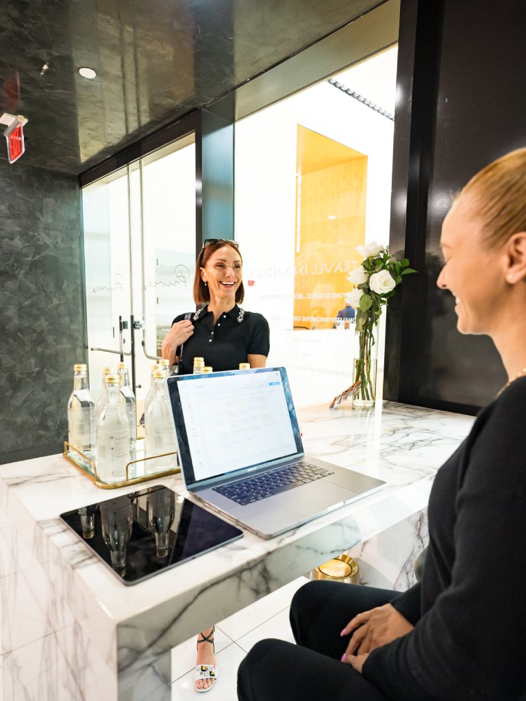 Client checking in to Casa Privee for pelvic floor therapy in Miami, FL with the EmSella Chair. Looking for pelvic floor therapy near me, book your appointment today.