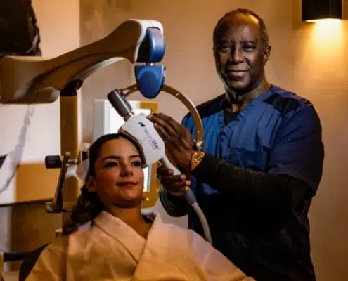 Dr. Bankole Johnson, internationally recognized neuropsychiatrist, administering TMS therapy for addiction to help with dopamine dysregulation. Book a consultation to learn more about how Transcranial Magnetic Stimulation can help treat addiction.